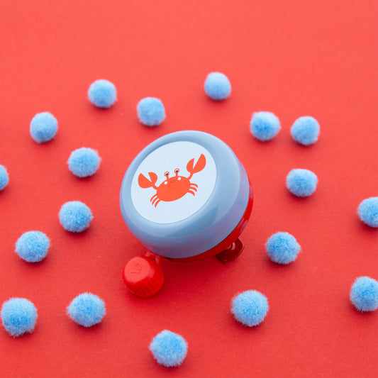 Widek kinderbel Explorer Clappy Crab rood/blauw op kaart